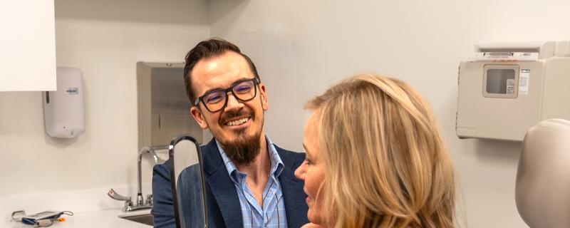 Plastic Surgeon Christopher Stewart, MD Consulting with A Patient