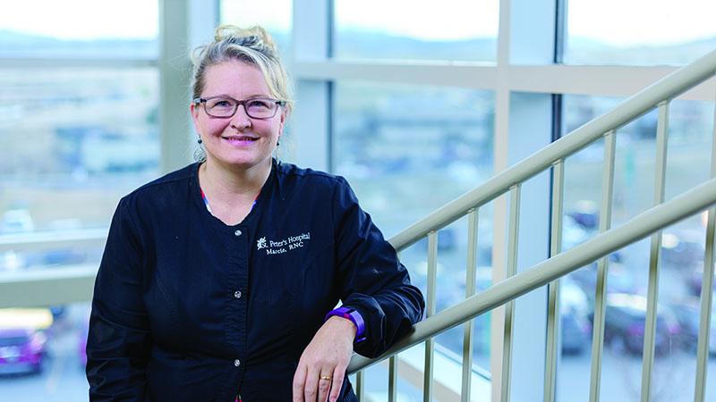 Employee smiling on rooftop